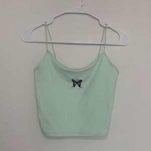 Small green spaghetti strap top with a cute little butterfly in the middle.